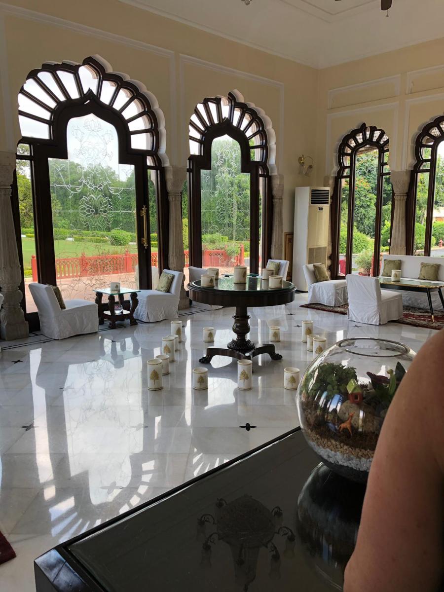 Sunlit palace lounge with arched windows